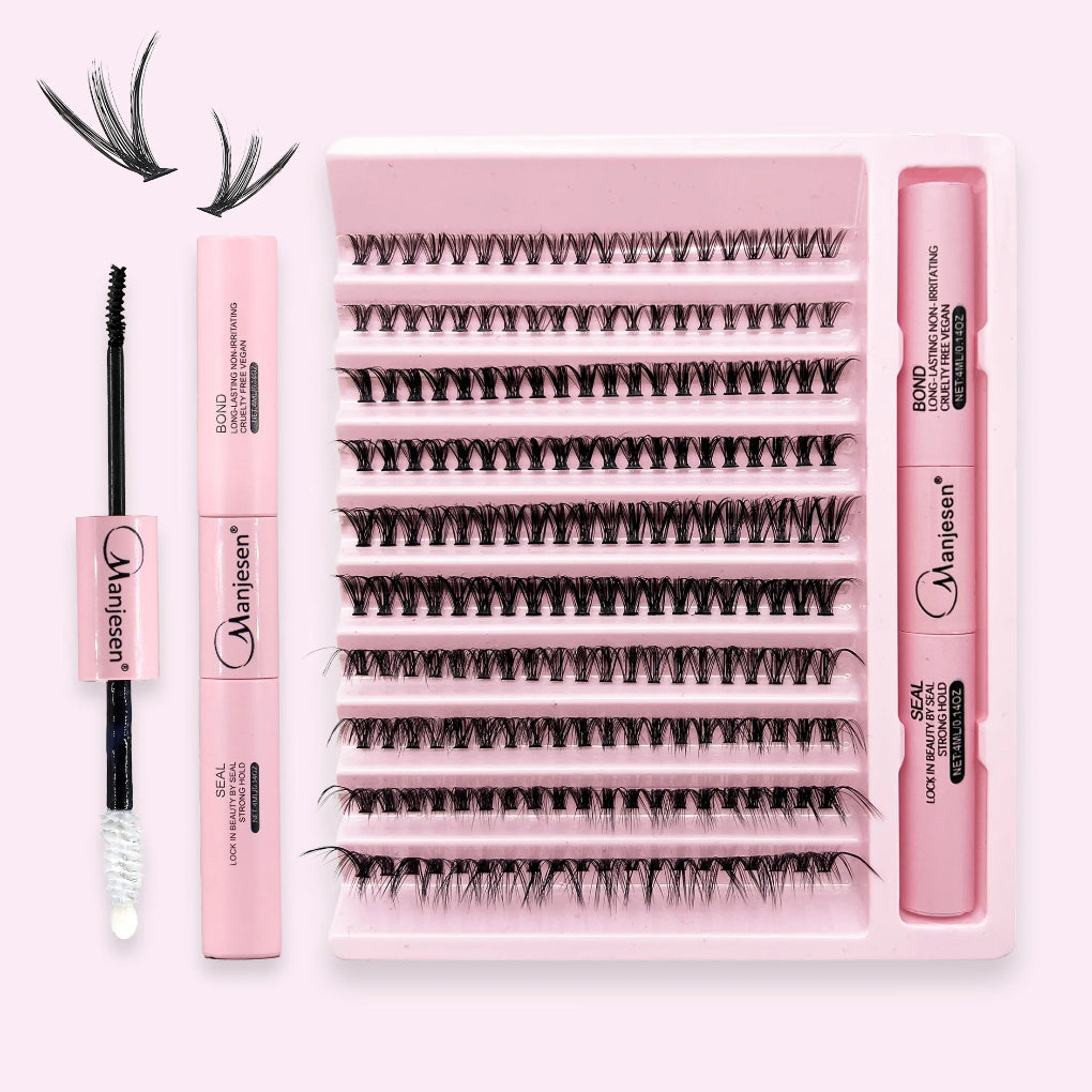 Set of false eyelashes with applicators and a brush on a pink background